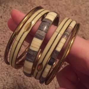 6 gold, gray, and white bangles